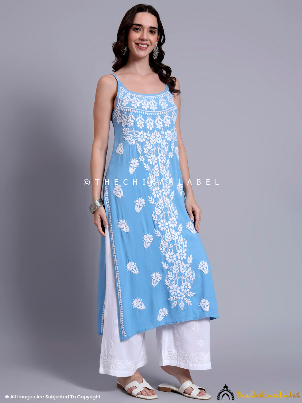 Lightweight long kurta in modal fabric featuring hand embroidery and minimalist silhouette, perfect for brunches, get-togethers, or casual office days.

