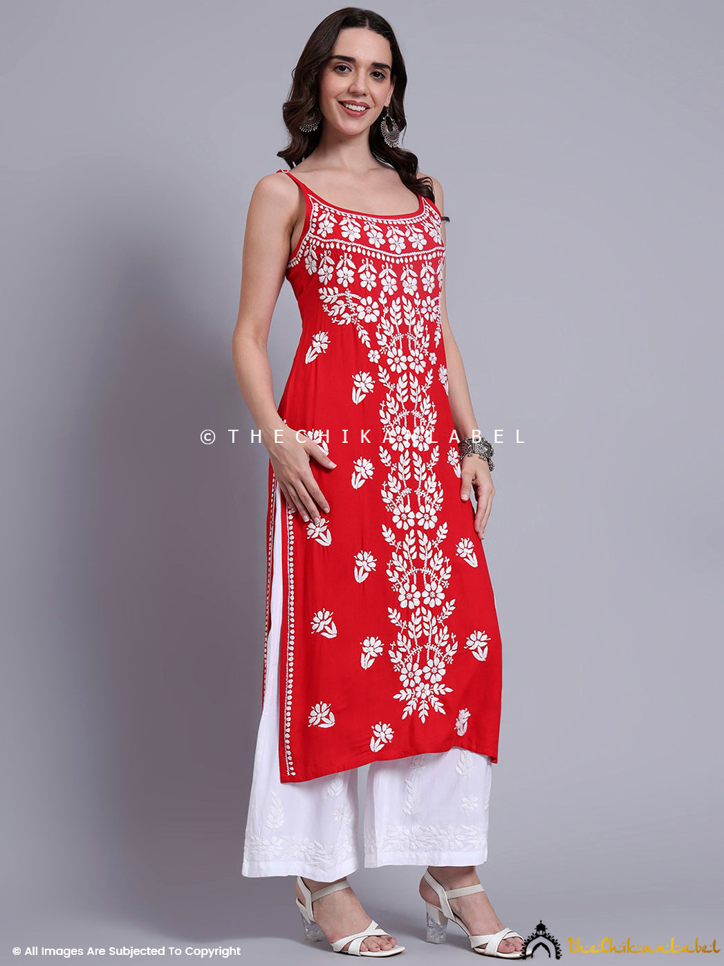 Designer strappy kurta crafted in modal fabric with elegant chikankari detailing, ideal for Indo-fusion occasions and contemporary festive looks.

