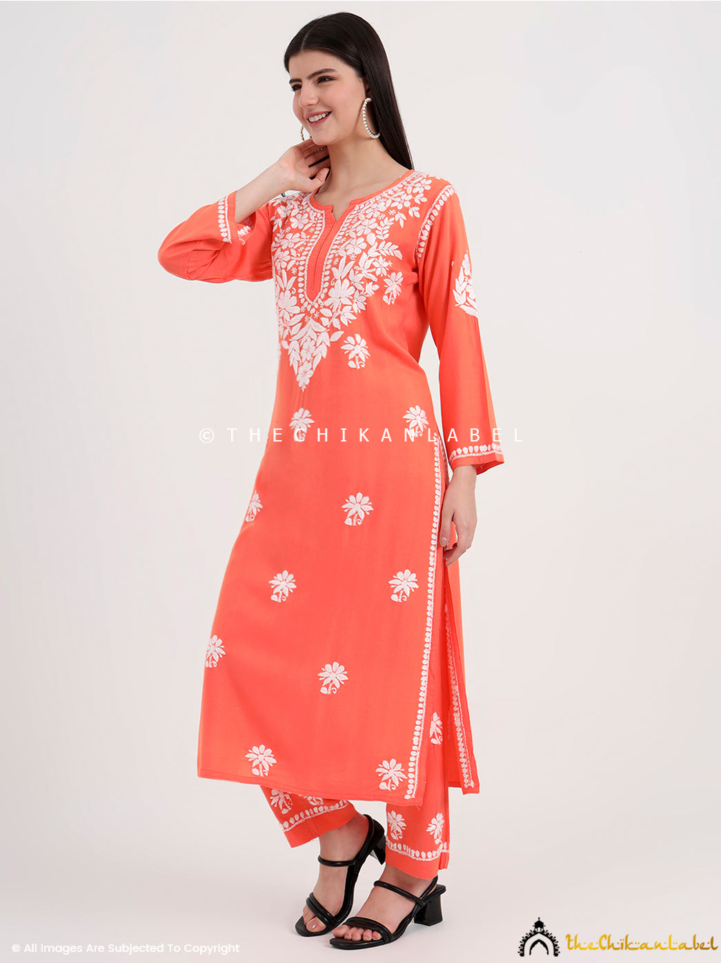 Hand-embroidered chikankari kurta set with detailed floral designs, ideal for casual gatherings and office wear.