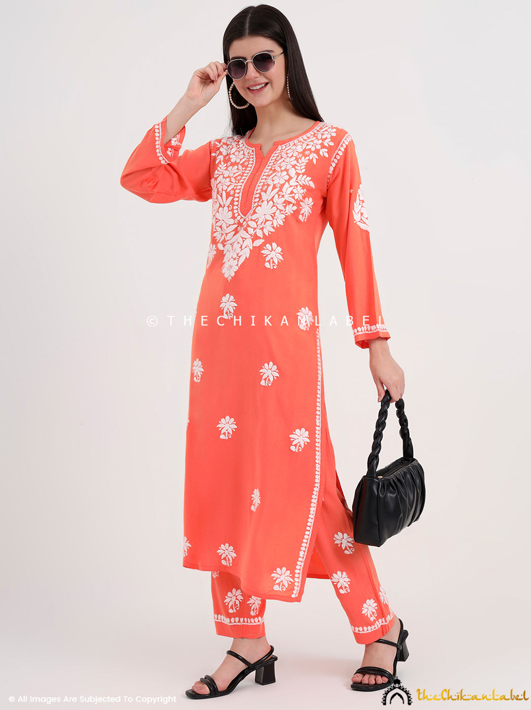 Authentic Lucknowi chikankari kurti paired with embroidered palazzo for a graceful ethnic outfit.