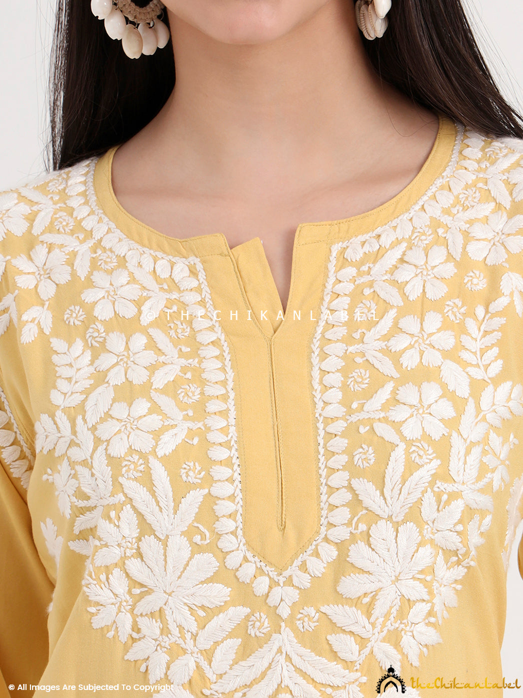 Traditional chikankari kurti and palazzo set crafted by skilled artisans with delicate floral embroidery motifs.