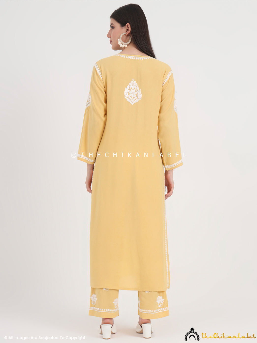 Stylish straight-cut kurti with full sleeves and matching palazzo pants showcasing authentic chikankari work.
