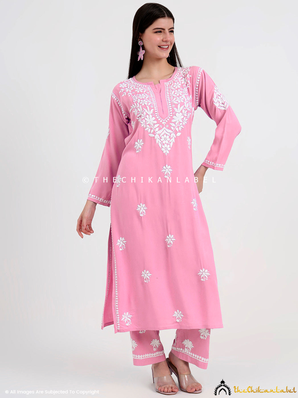 Traditional chikankari kurti and palazzo set crafted by skilled artisans with delicate floral embroidery motifs.