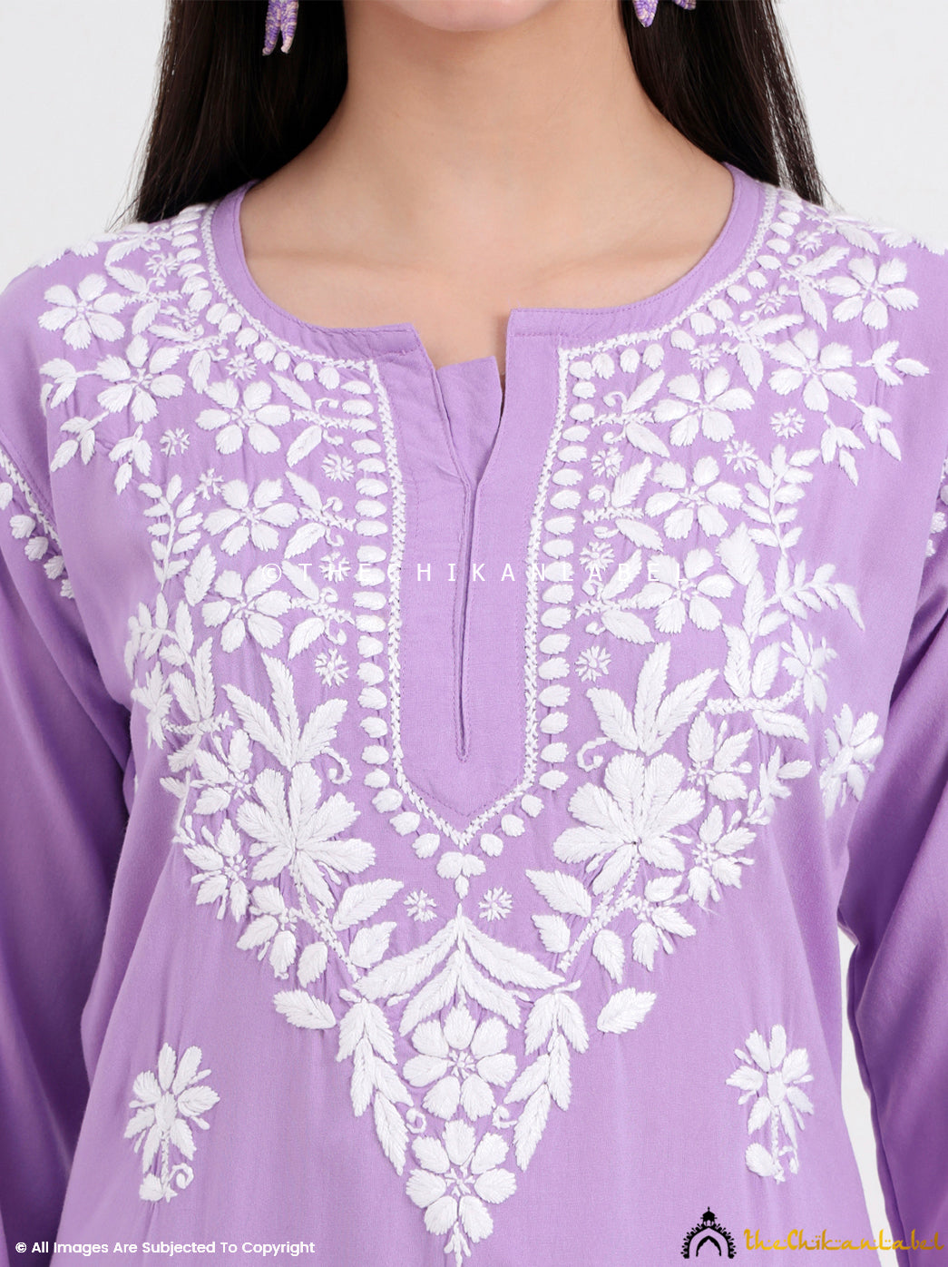Traditional chikankari kurti and palazzo set crafted by skilled artisans with delicate floral embroidery motifs.