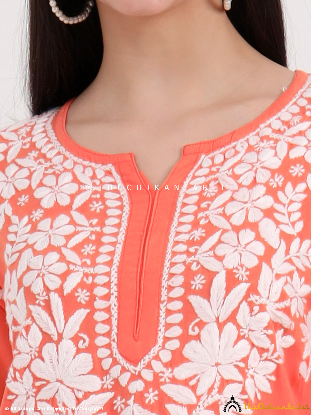 Traditional chikankari kurti and palazzo set crafted by skilled artisans with delicate floral embroidery motifs.