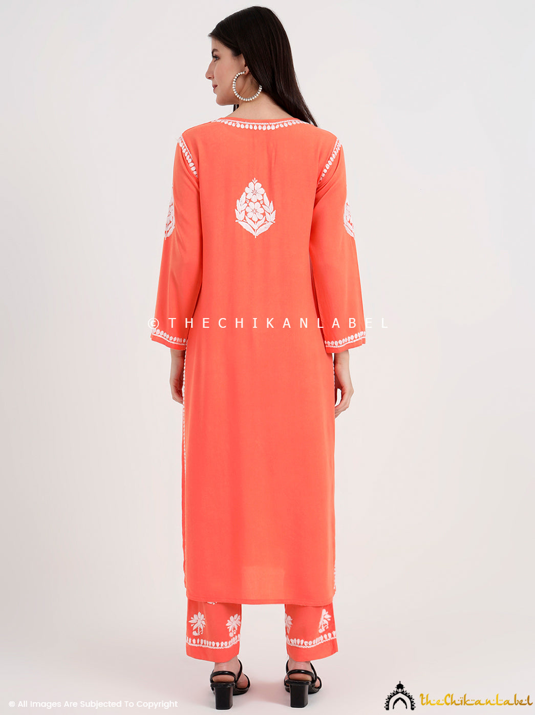 Stylish straight-cut kurti with full sleeves and matching palazzo pants showcasing authentic chikankari work.