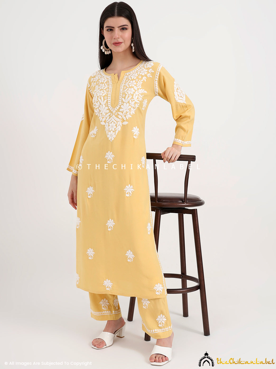 Authentic Lucknowi chikankari kurti paired with embroidered palazzo for a graceful ethnic outfit.