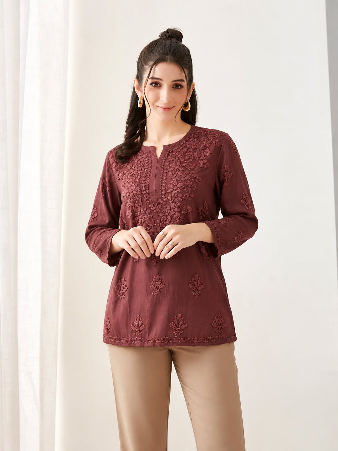 Amina Rayon Short Kurti for women featuring detailed Chikankari embroidery, three-quarter sleeves, relaxed silhouette and comfortable everyday styling with wide-leg trousers.