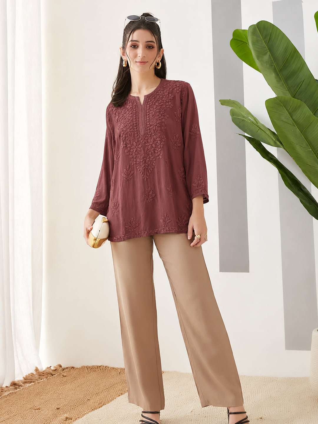 Comfortable regular wear short kurta for women featuring traditional Chikankari embroidery, lightweight rayon fabric, relaxed fit and versatile styling for casual outings.