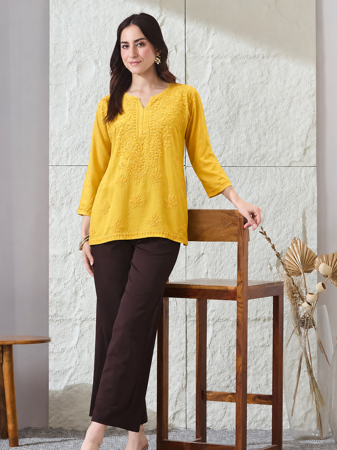 Comfortable Amina Rayon Short Kurti featuring traditional Chikankari embroidery and a contemporary short length, paired with wide-leg trousers for an effortless everyday look.