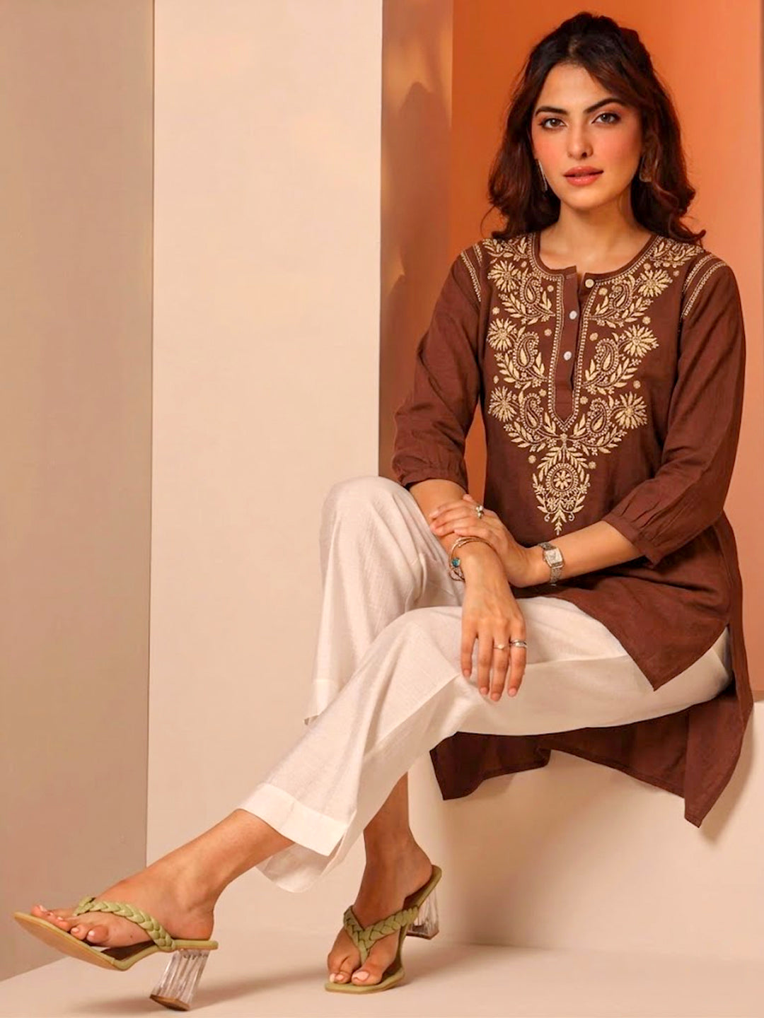 Elegant women’s chikankari kurti featuring fine embroidery craftsmanship on the front panel with a clean and structured design for contemporary ethnic wear.