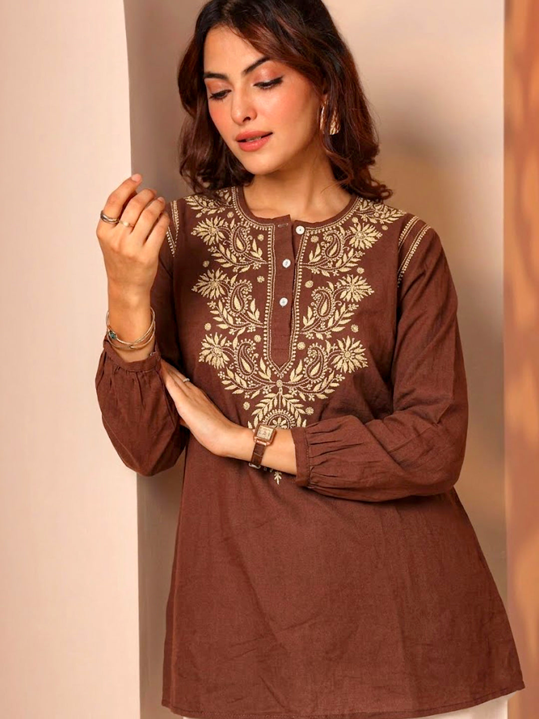 Stylish chikankari kurti showcasing detailed floral embroidery, straight cut design, and elegant neckline suitable for modern ethnic outfits.