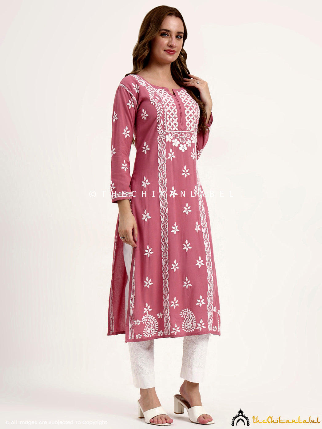 Elegant chikankari straight kurti crafted in soft rayon fabric with traditional embroidery details.