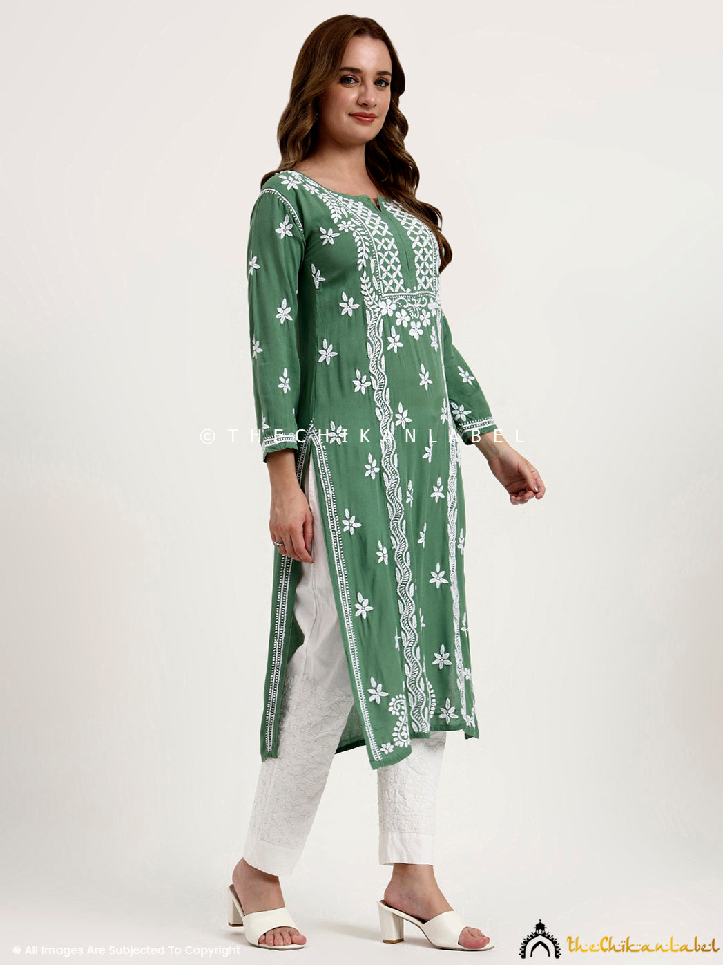 Handcrafted chikankari embroidery on rayon kurti with stylish straight silhouette.