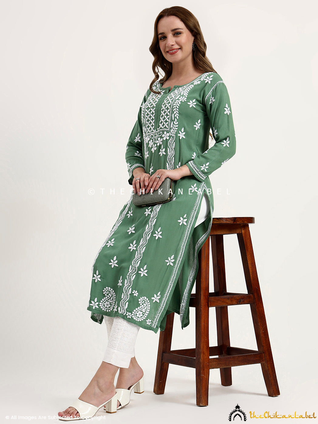 Women’s ethnic wear kurti in rayon featuring delicate chikankari floral patterns.