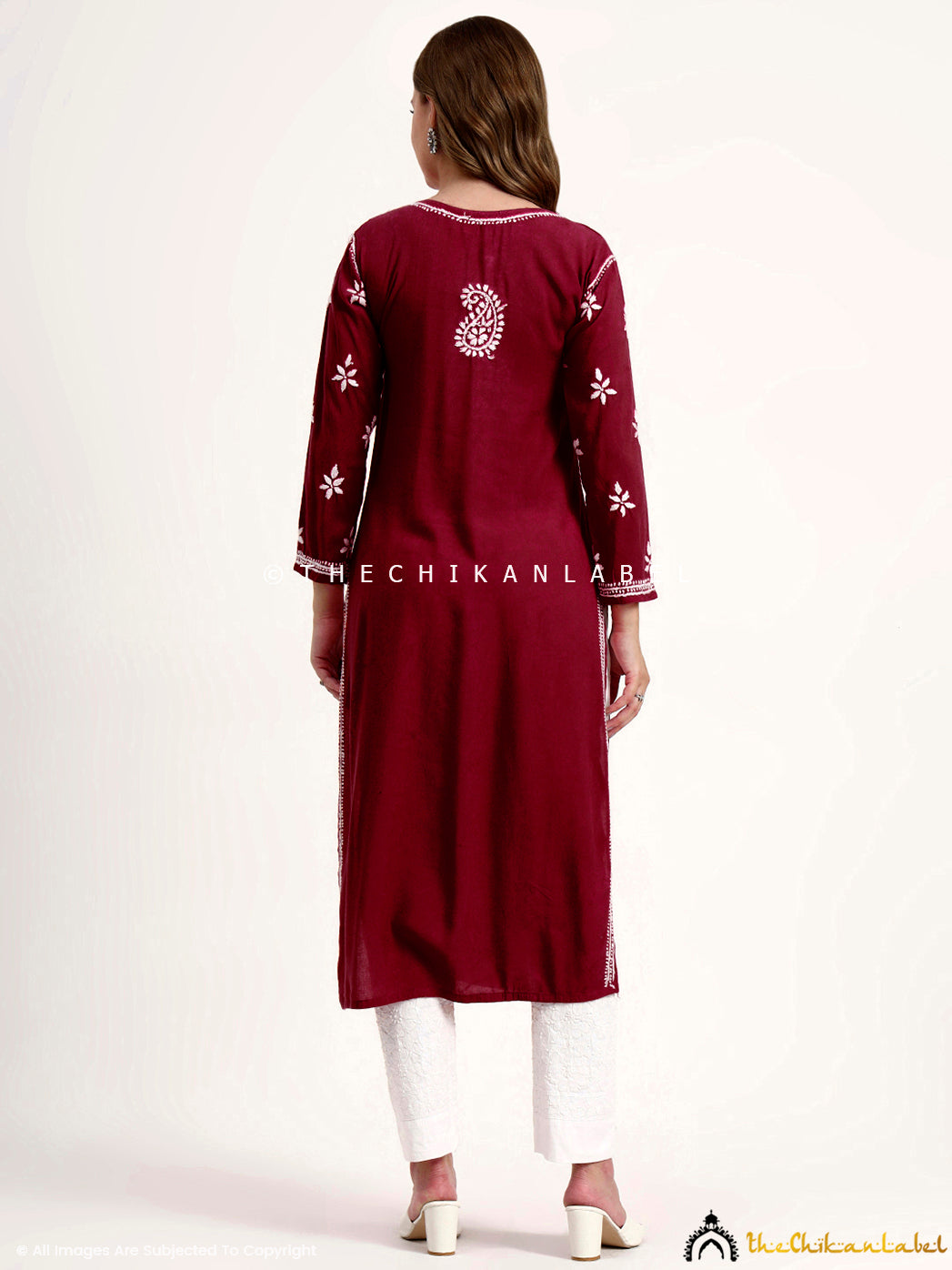 Handcrafted chikankari embroidery on rayon kurti with stylish straight silhouette.