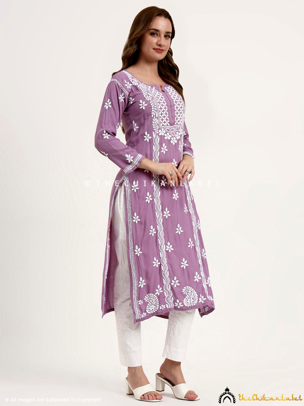 Handcrafted chikankari embroidery on rayon kurti with stylish straight silhouette.