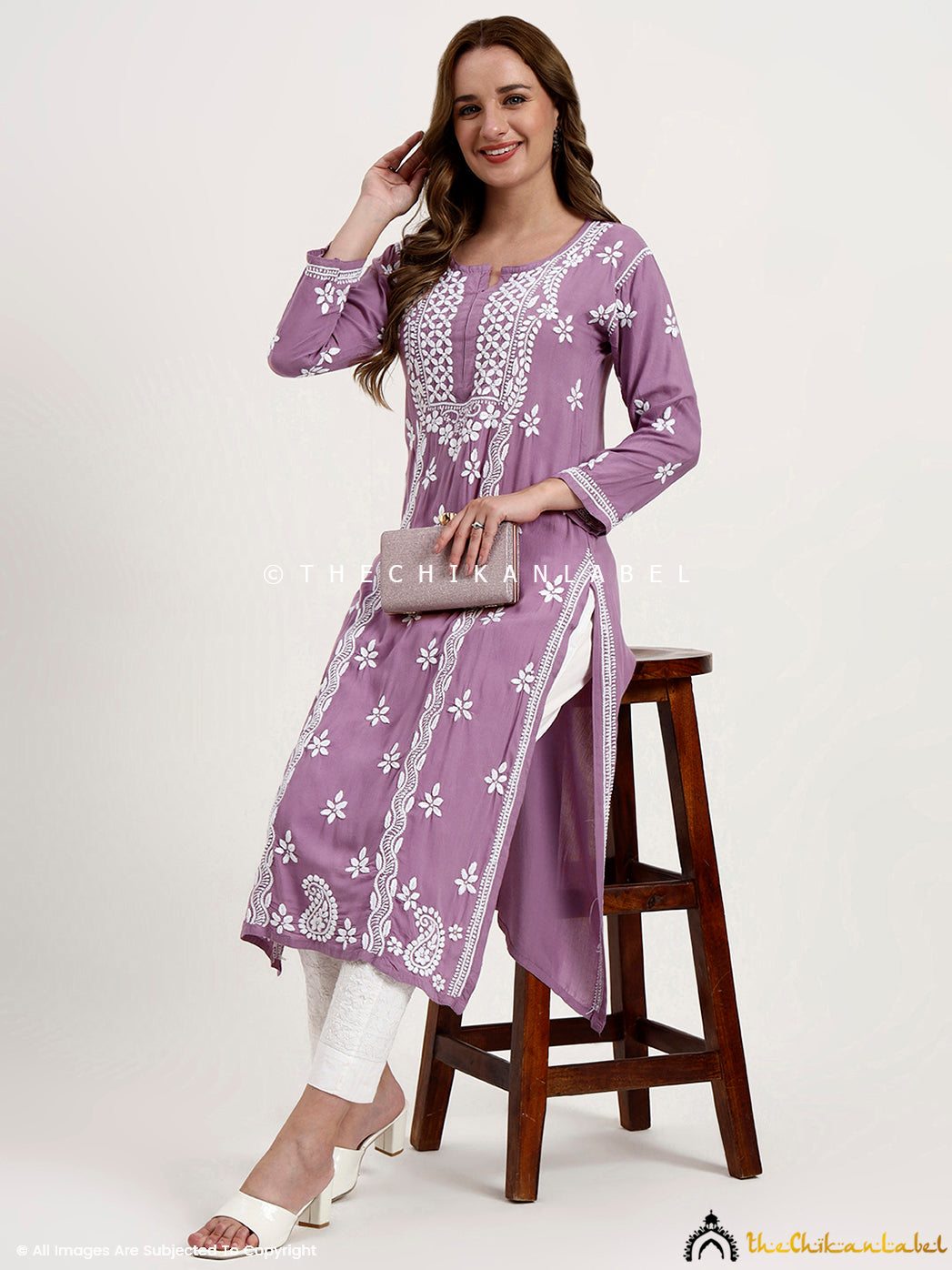 Women’s ethnic wear kurti in rayon featuring delicate chikankari floral patterns.