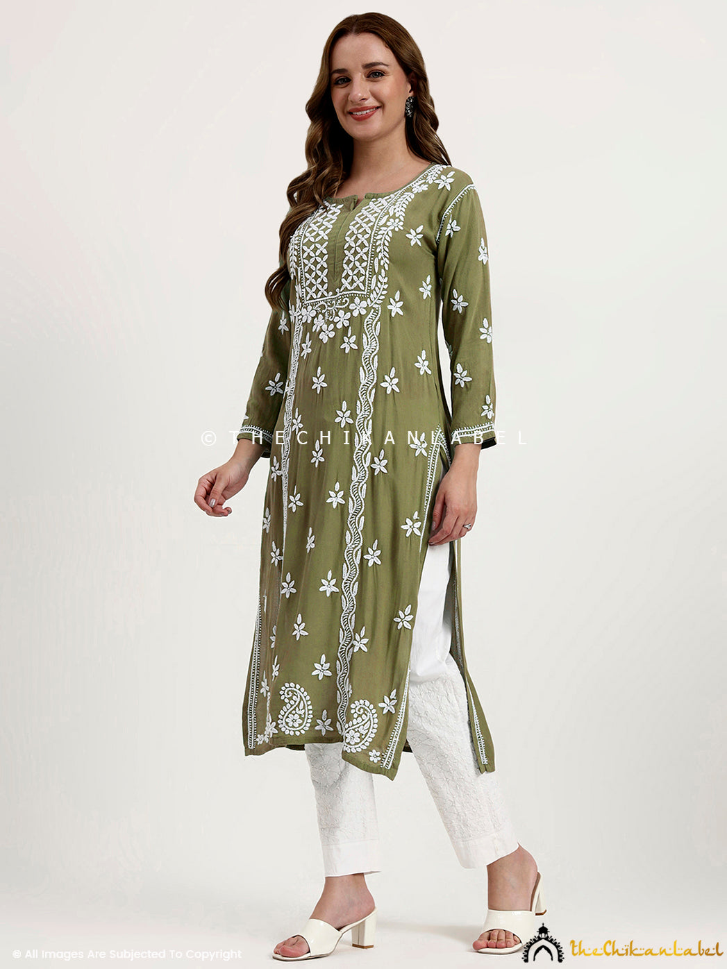 Women’s rayon chikankari kurti showcasing fine embroidery and straight silhouette design.