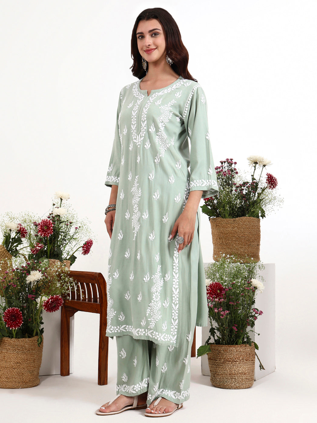 Graceful chikankari kurta set featuring detailed neckline and all over embroidery work