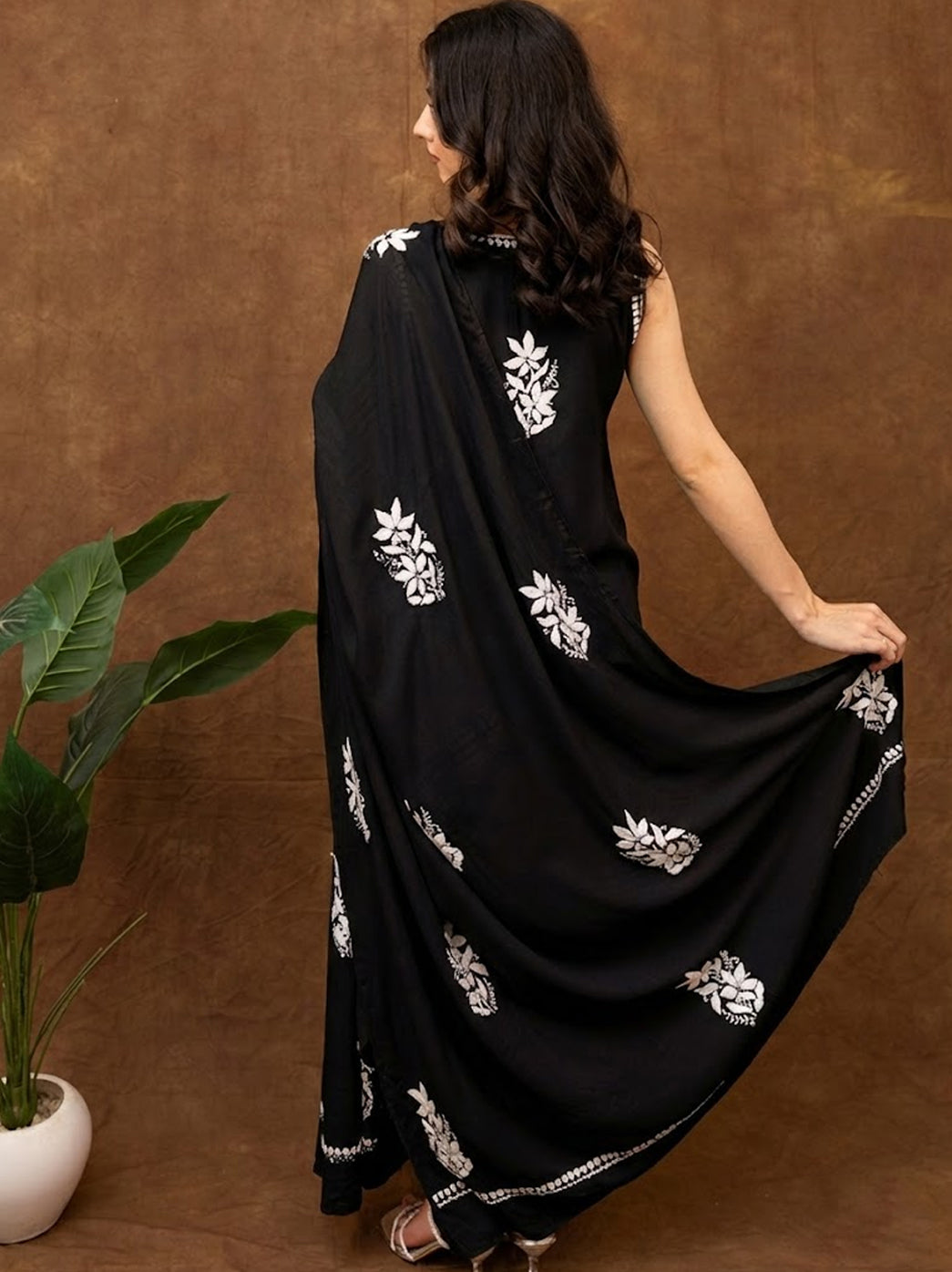 Lucknow chikankari sleeveless kurta featuring fine hand embroidered motifs, paired with embroidered pants and a soft drape dupatta