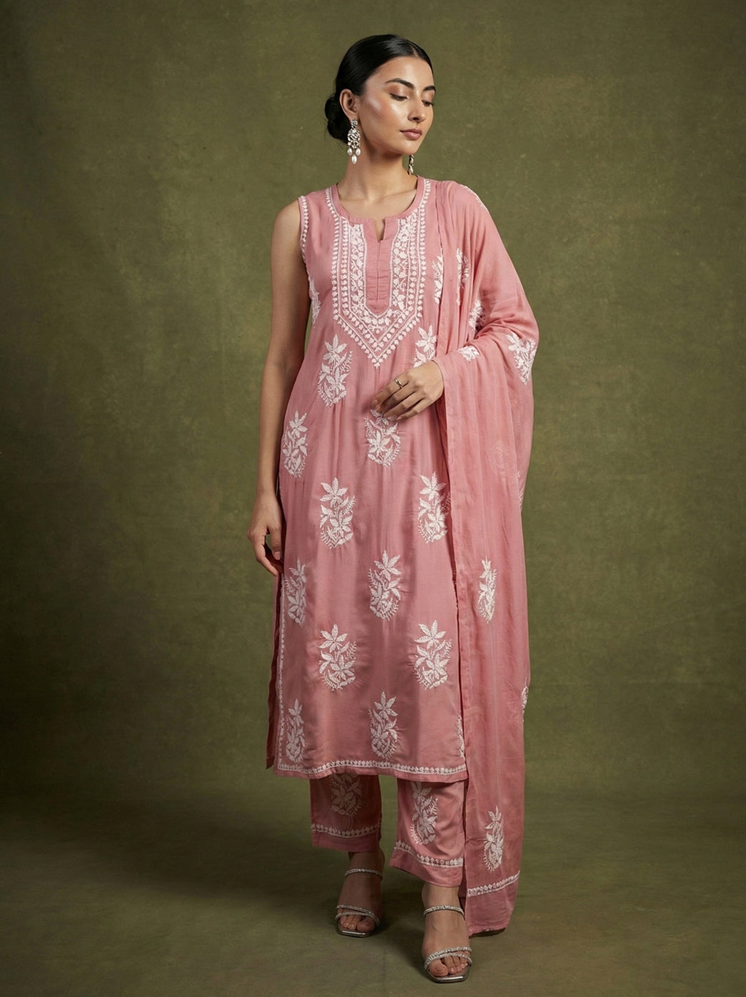 Traditional hand chikankari kurta highlighting detailed floral motifs and neckline work, worn with straight bottoms and matching dupatta