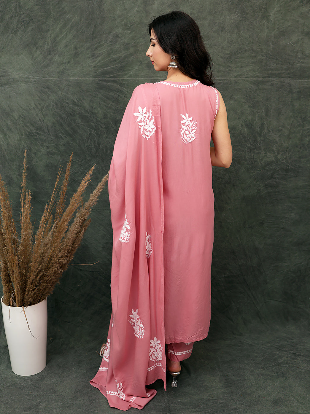 Hand embroidered chikankari kurta set designed with intricate traditional motifs, offering a timeless ethnic look with coordinated pants and dupatta