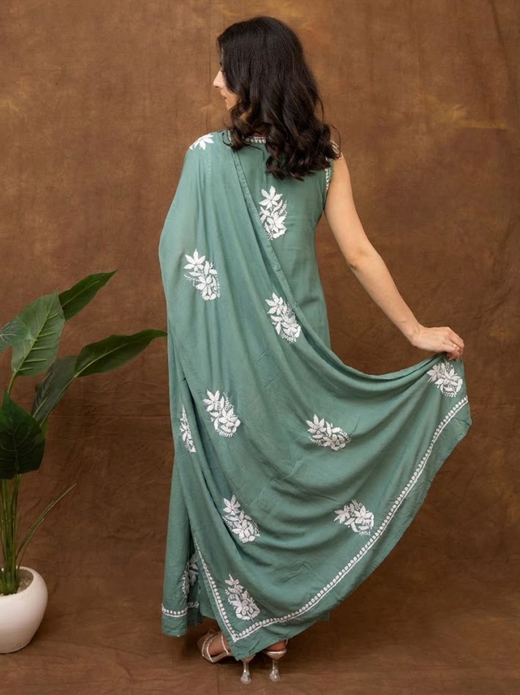 Designer chikankari kurta set with detailed hand embroidery on breathable fabric, styled with coordinated pants and dupatta for cultural gatherings