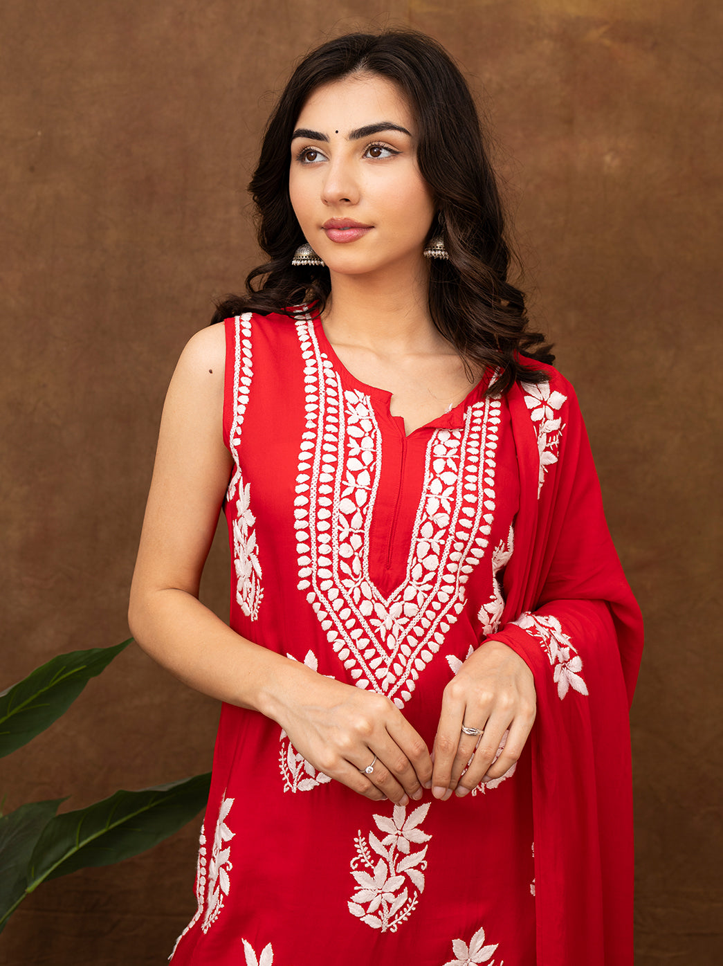 Ethnic chikankari kurta and pant set with fine hand embroidery motifs, breathable fabric, and coordinated dupatta, ideal for festive gatherings