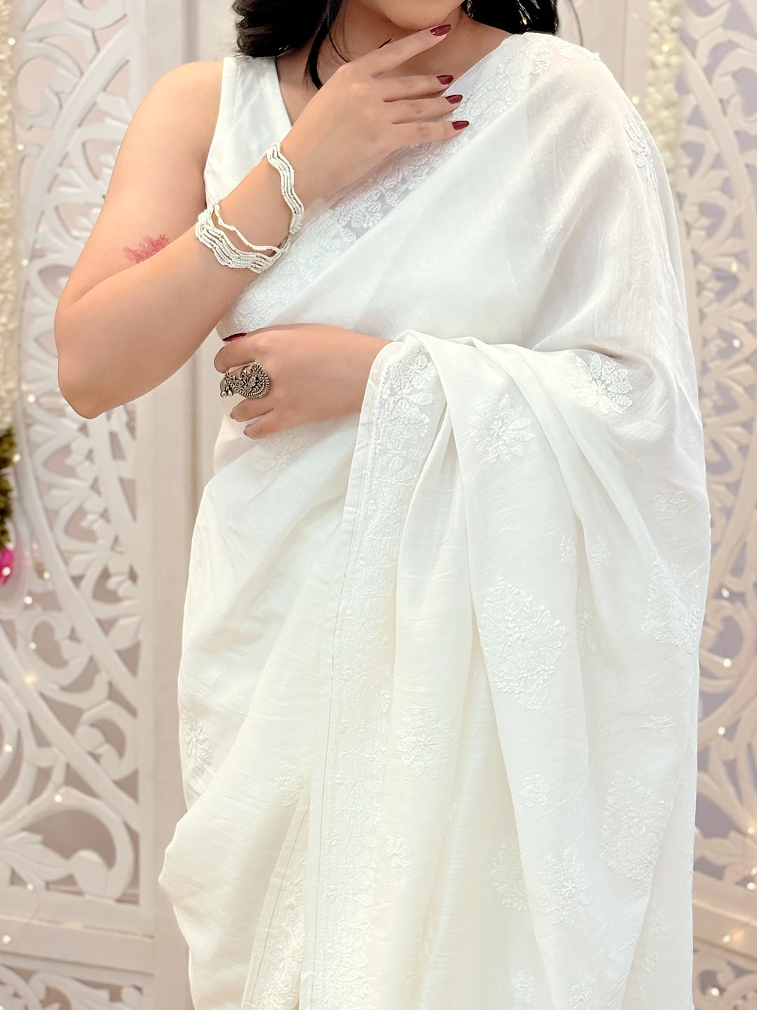 Chanderi hand-embroidered chikankari saree with intricate thread detailing perfect for wedding and festive occasions.