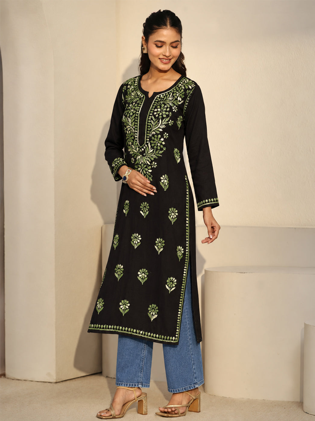 Front view of the Ayra Rayon Straight Kurti by The Chikan Label, displaying a decorative floral neckline panel, evenly spaced botanical motifs and embroidered detailing along the cuffs and hem.