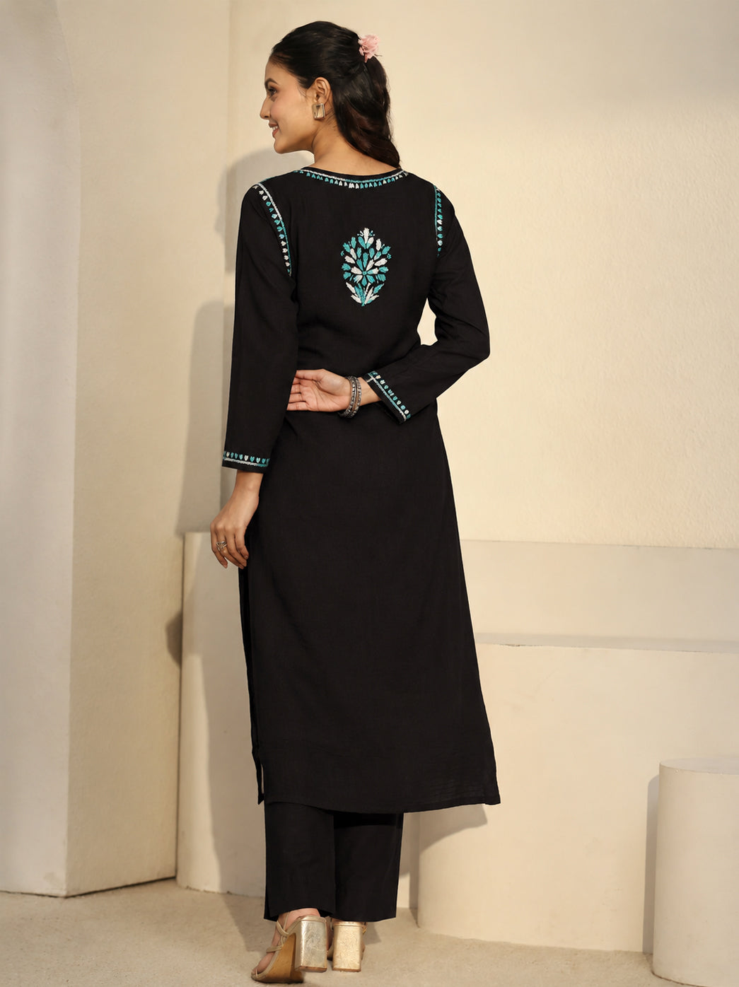 Ayra Rayon Straight Kurti styled for an everyday outfit with cropped jeans, simple jewellery and strappy sandals, with floral embroidery framing the neckline and outlining the garment borders.