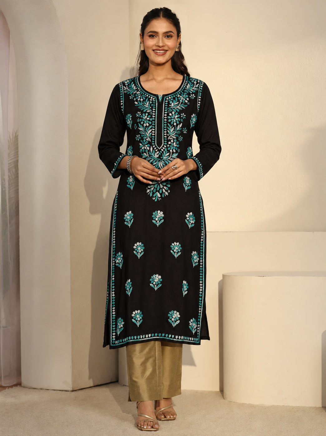 The Chikan Label Ayra Rayon Straight Kurti with leafy vines and floral embroidery across the upper front, smaller motifs below and decorative borders along the long straight hem.
