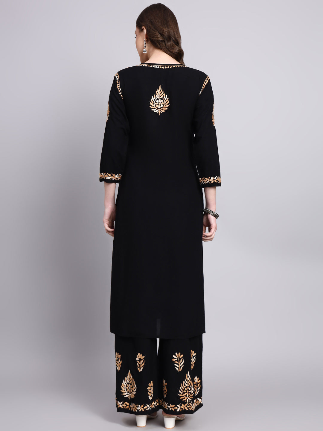 Elegant rayon chikankari kurta palazzo set showcasing detailed hand embroidered motifs in a stylish ethnic wear set for women