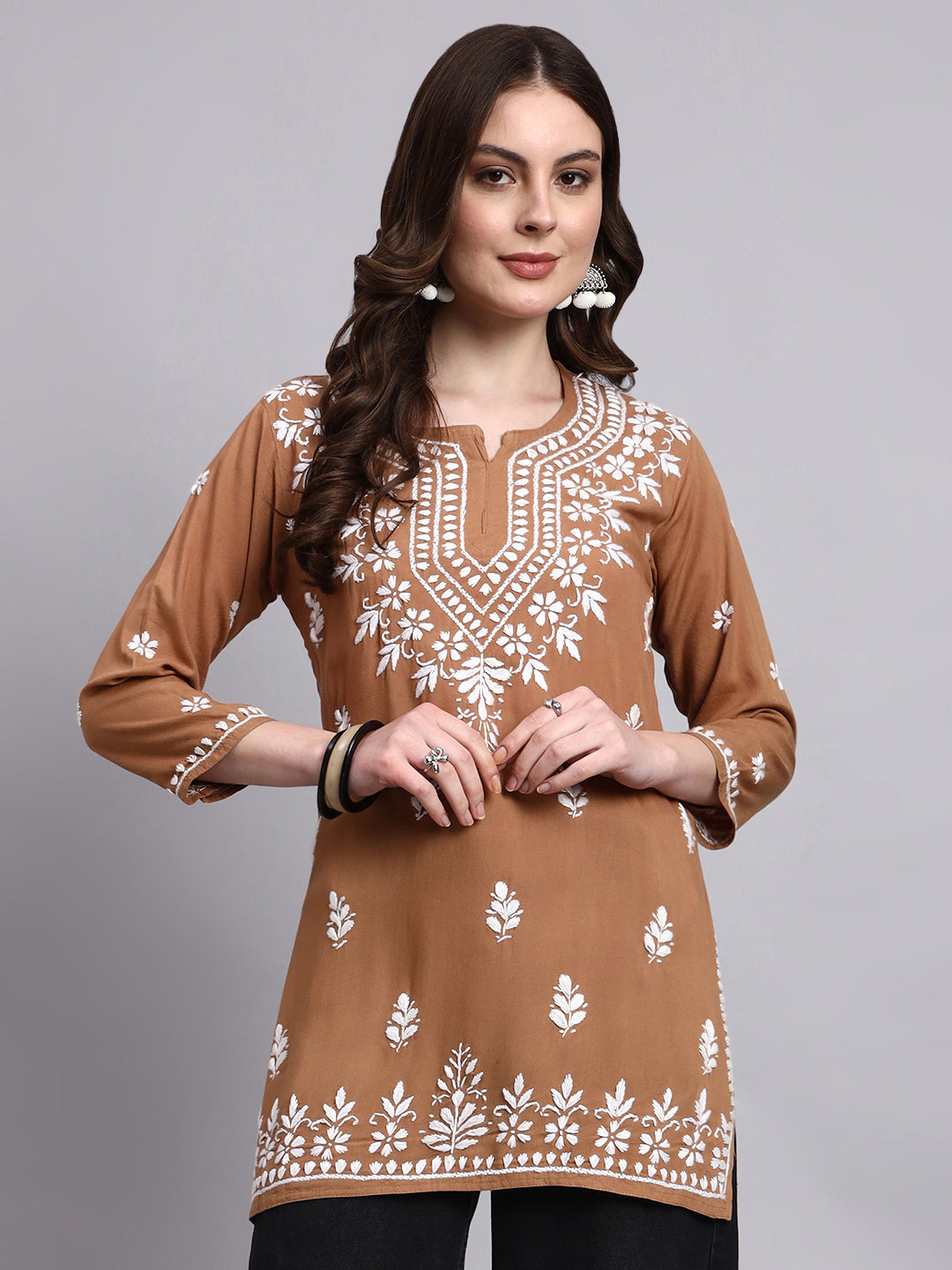 Handmade chikankari short kurta crafted in soft rayon fabric with intricate floral embroidery on neckline and hem for everyday ethnic wear