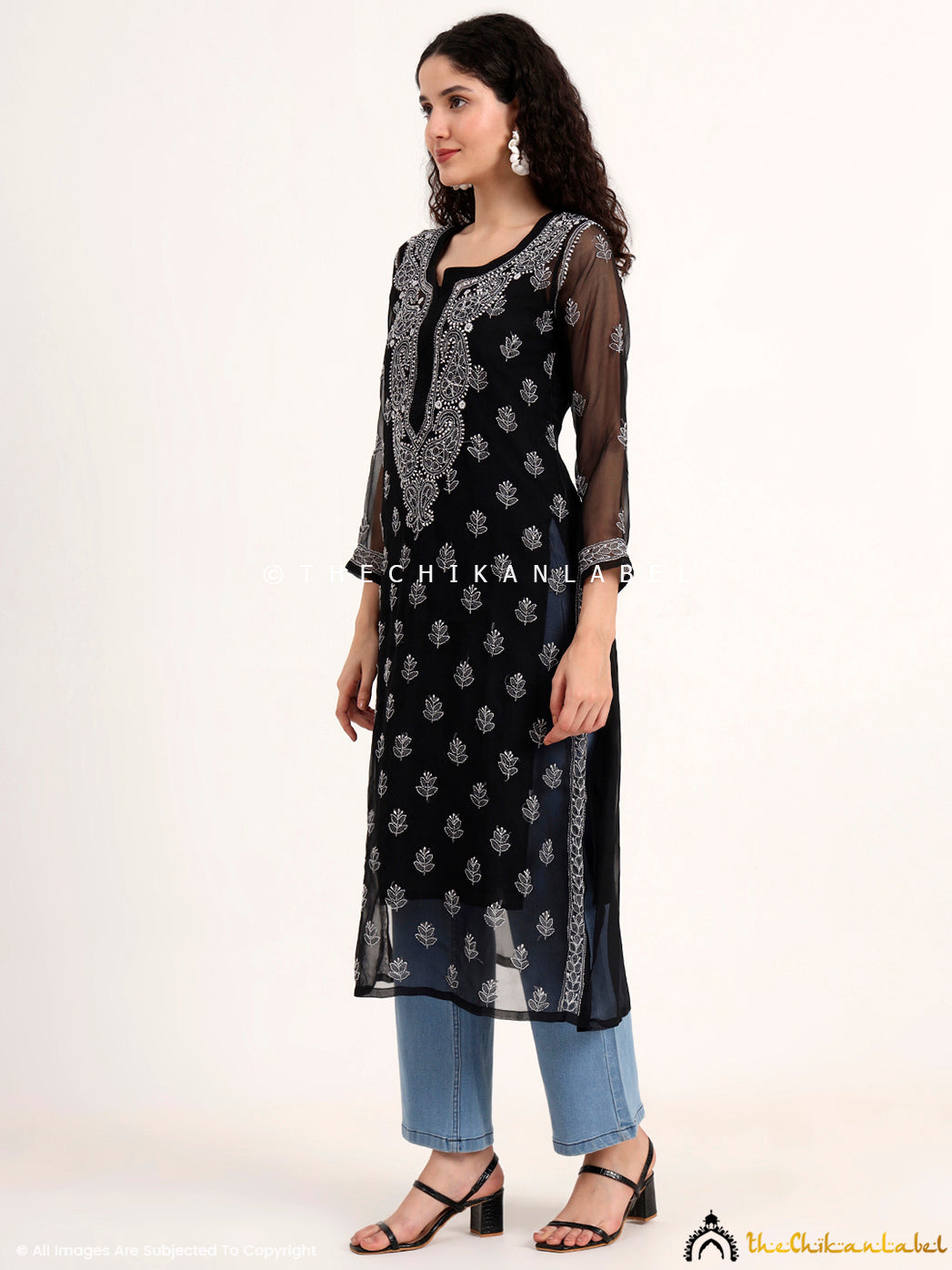 Trending black chikankari kurti featuring Lucknowi embroidery, perfect for festive gatherings, office wear, and stylish ethnic evenings.