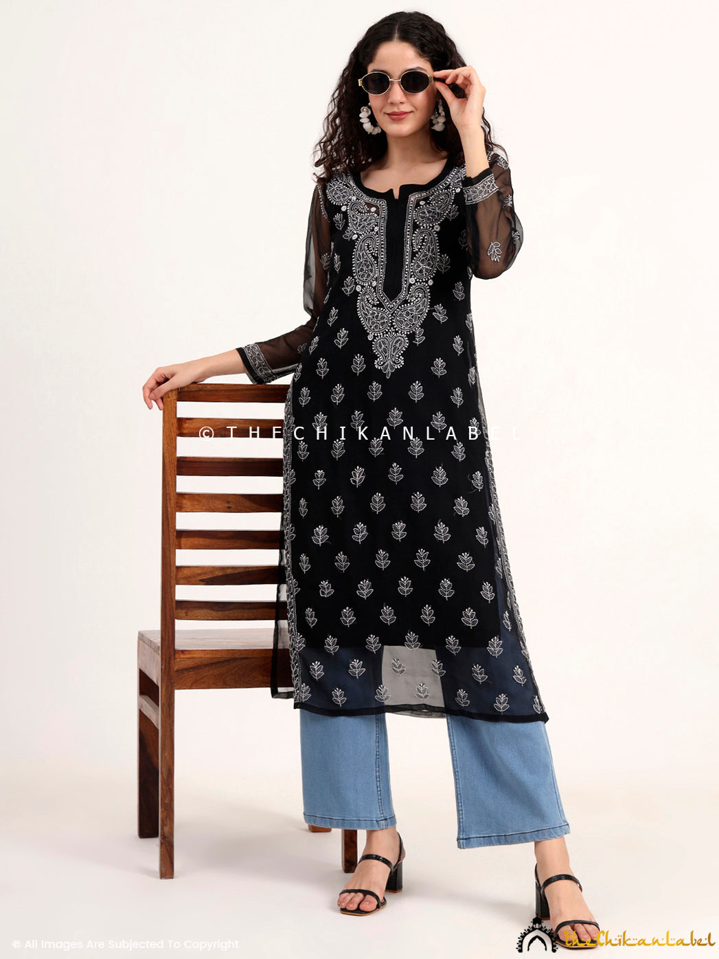 Viral chikankari kurti in black with delicate floral motifs and neckline detailing, designed for modern Indian women embracing heritage wear.