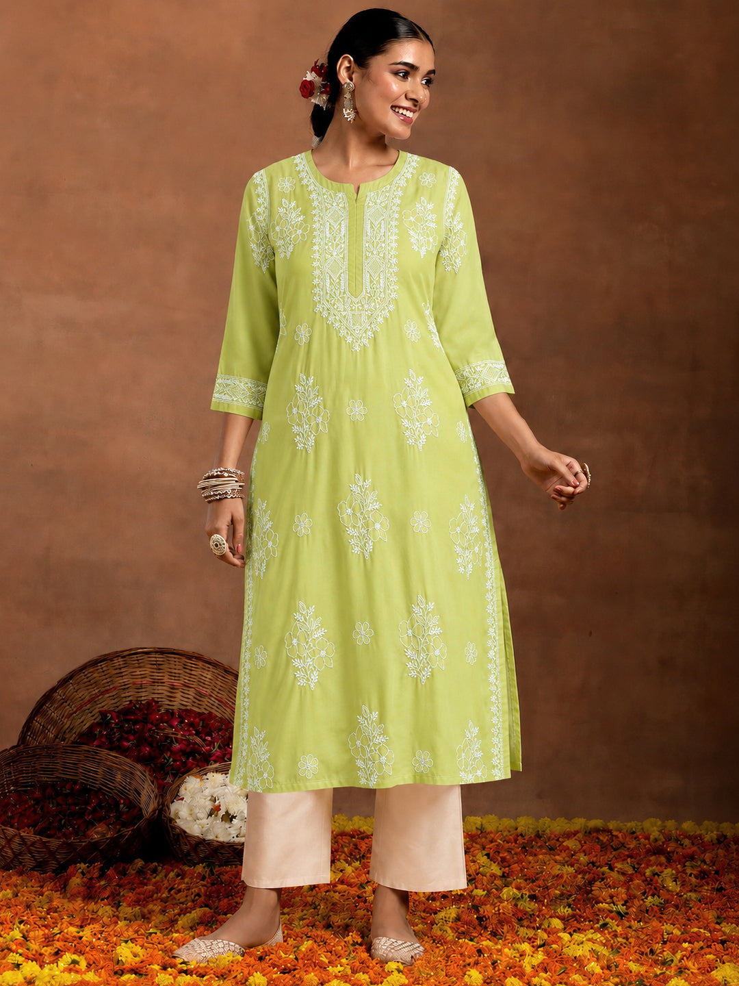 Chhavi Cotton Straight Kurti with inner featuring detailed Chikankari embroidery, straight silhouette and breathable cotton fabric for comfortable regular wear.