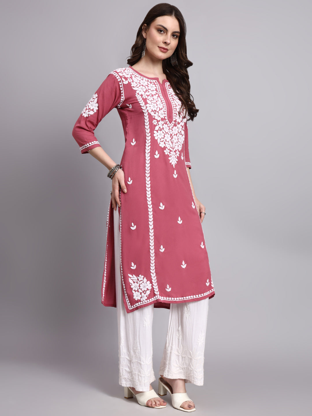 Straight fit chikankari long kurta for women designed with lightweight rayon fabric and intricate handcrafted floral motifs