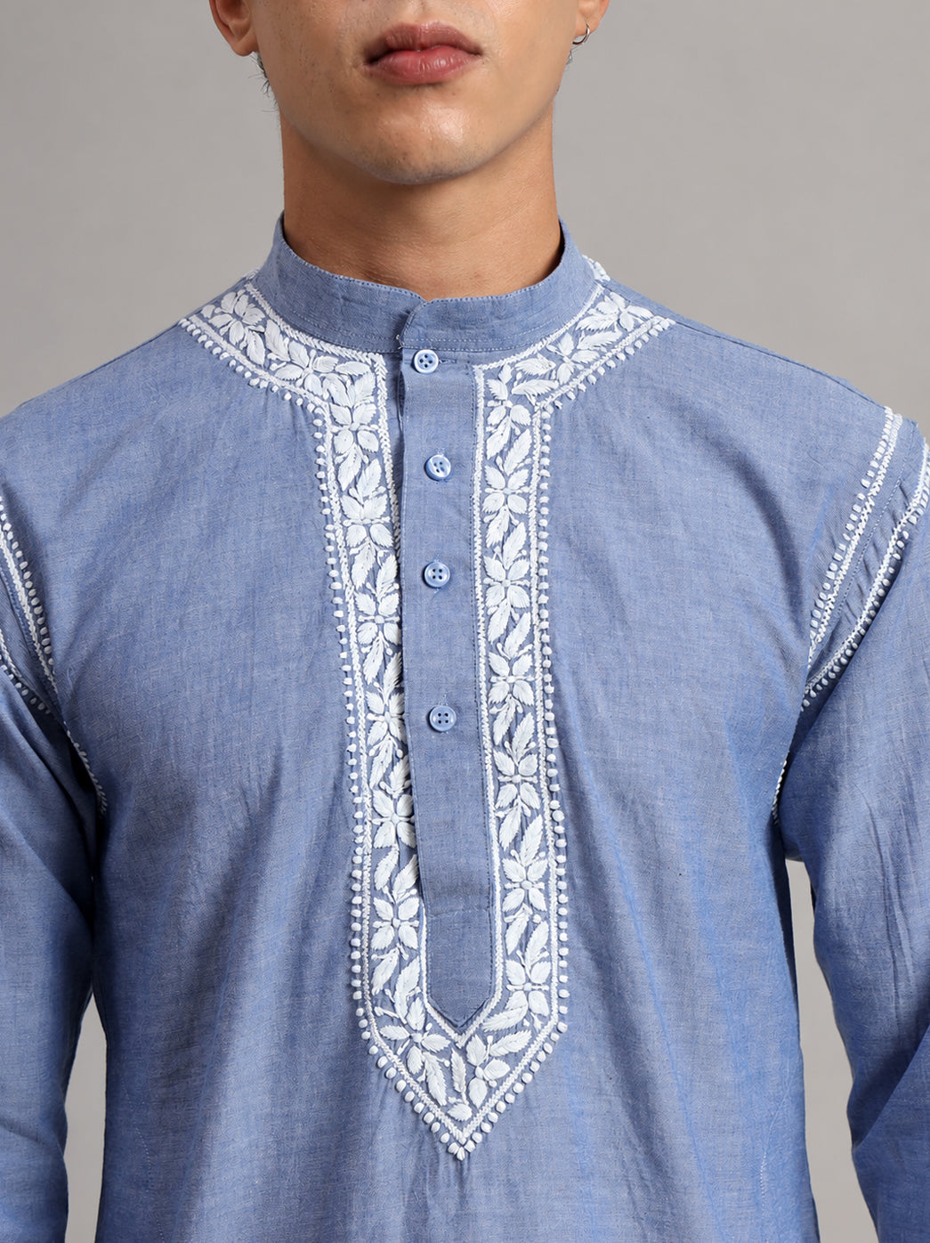 Front view of the Denim men's Chikankari kurta showing full sleeves, a straight silhouette and an elongated embroidered chest panel with a pointed lower border.