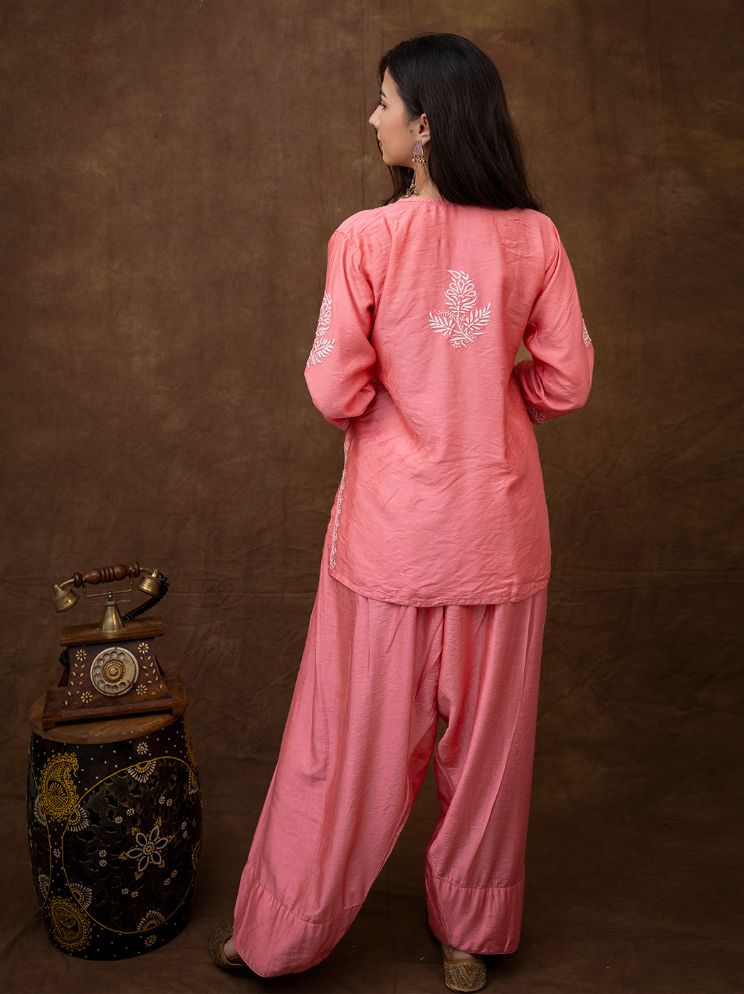 Model wearing Dhanvi Chanderi kurti farshi salwar set featuring intricate hand chikankari embroidery and traditional Indian styling.