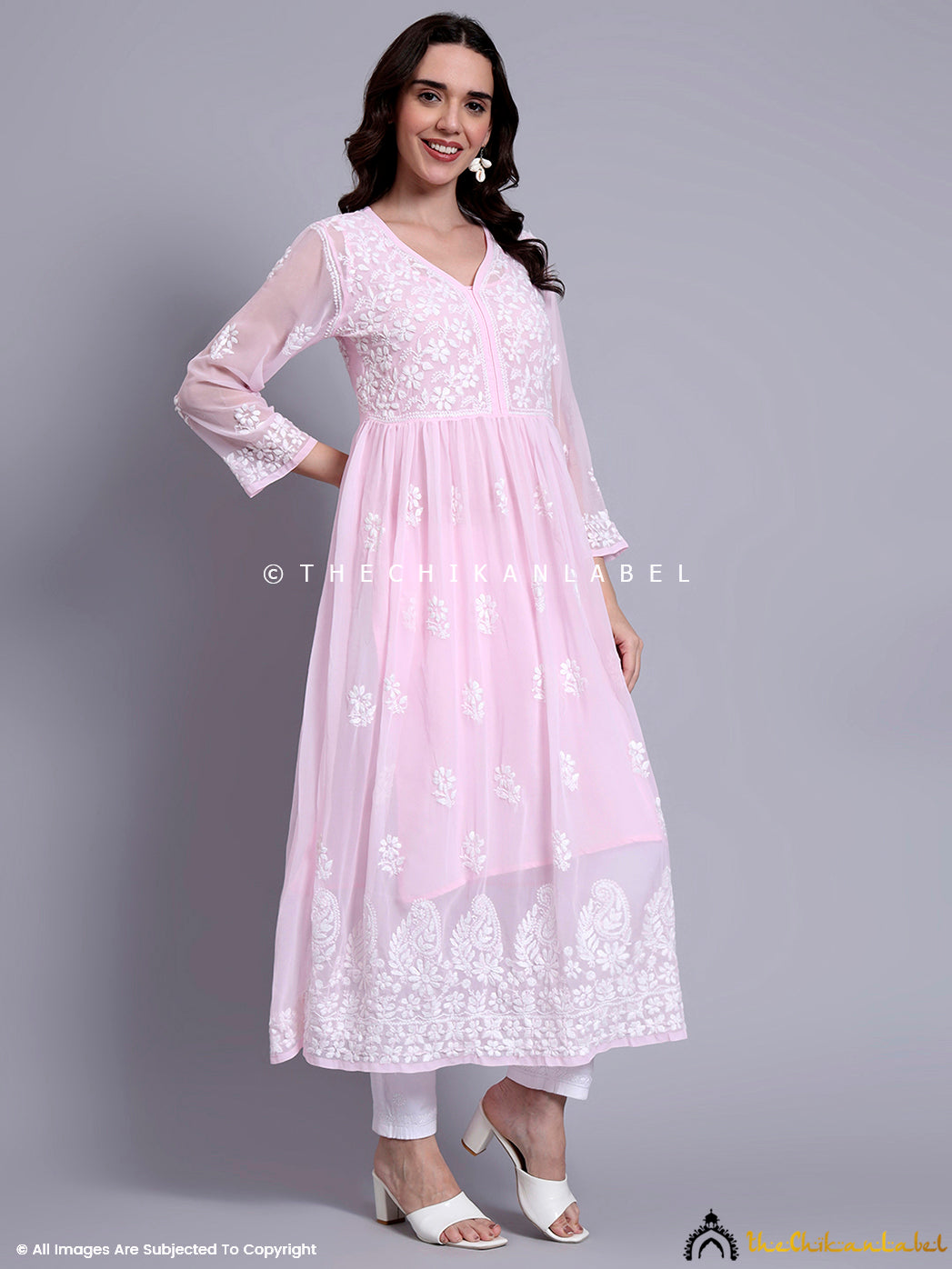 Ethnic wear collection display featuring handcrafted chikankari A-line kurti with intricate embroidery patterns.

