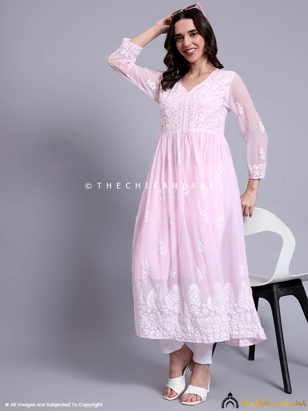 Detailed embroidery close-up on georgette kurti with Lucknowi chikankari floral jaal and paisley motifs.

