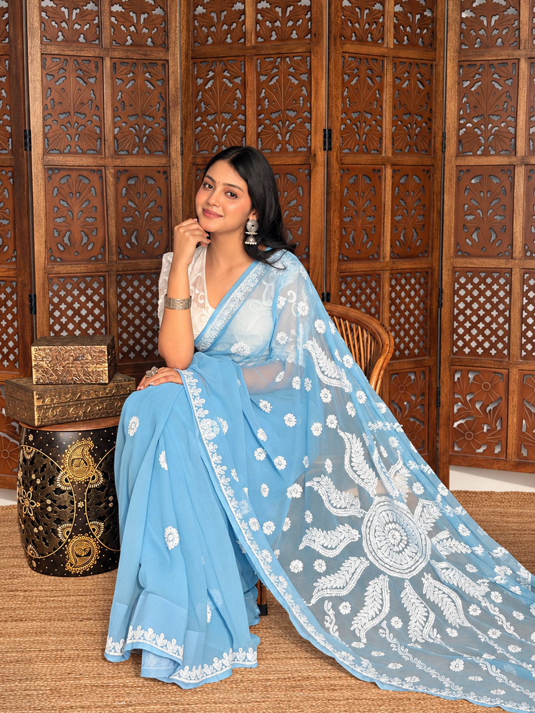 Elegant Chikankari saree for women crafted from georgette fabric with detailed floral threadwork, an intricately embroidered pallu, and traditional border detailing, perfect for festive occasions and special celebrations.