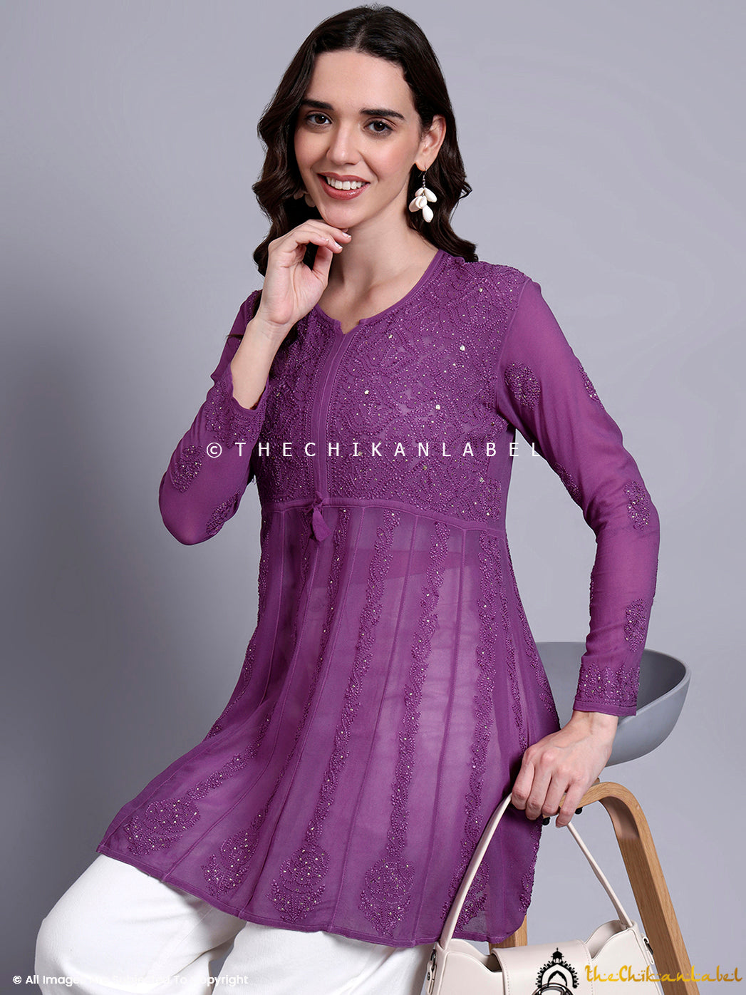 Viscose chikankari top with round neckline and mirror work accents, ideal for comfortable ethnic styling.

