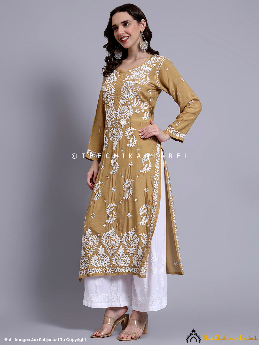 Graceful ethnic ensemble highlighting fine chikankari work done on breathable muslin fabric.

