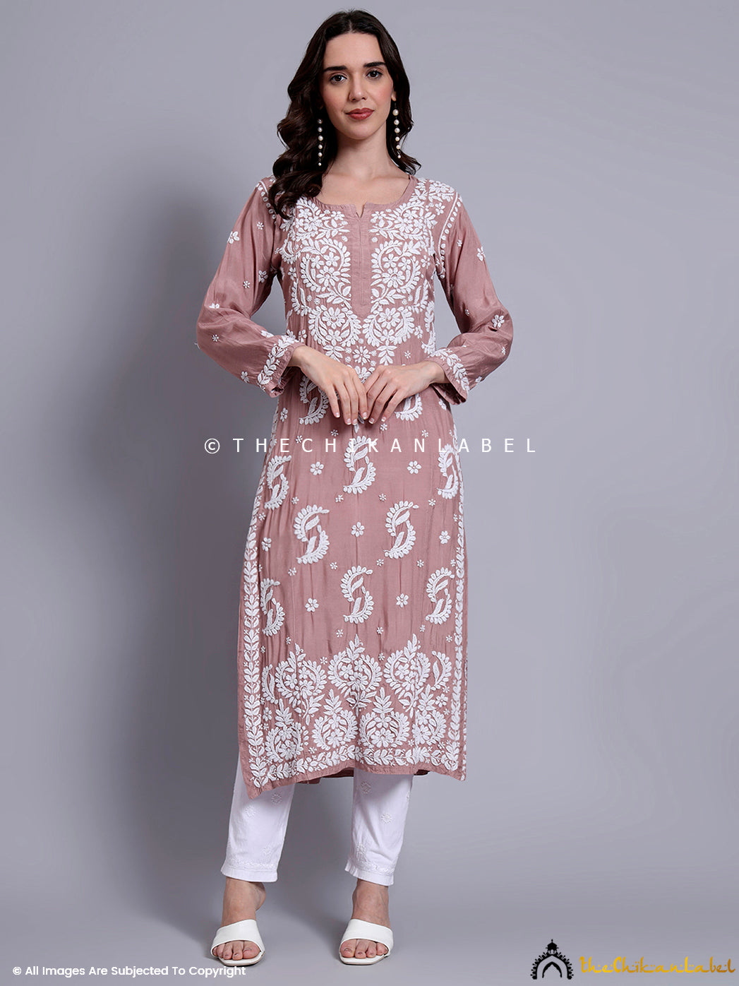 Full front image of lightweight muslin kurti with intricate chikankari thread work on neckline and body.

