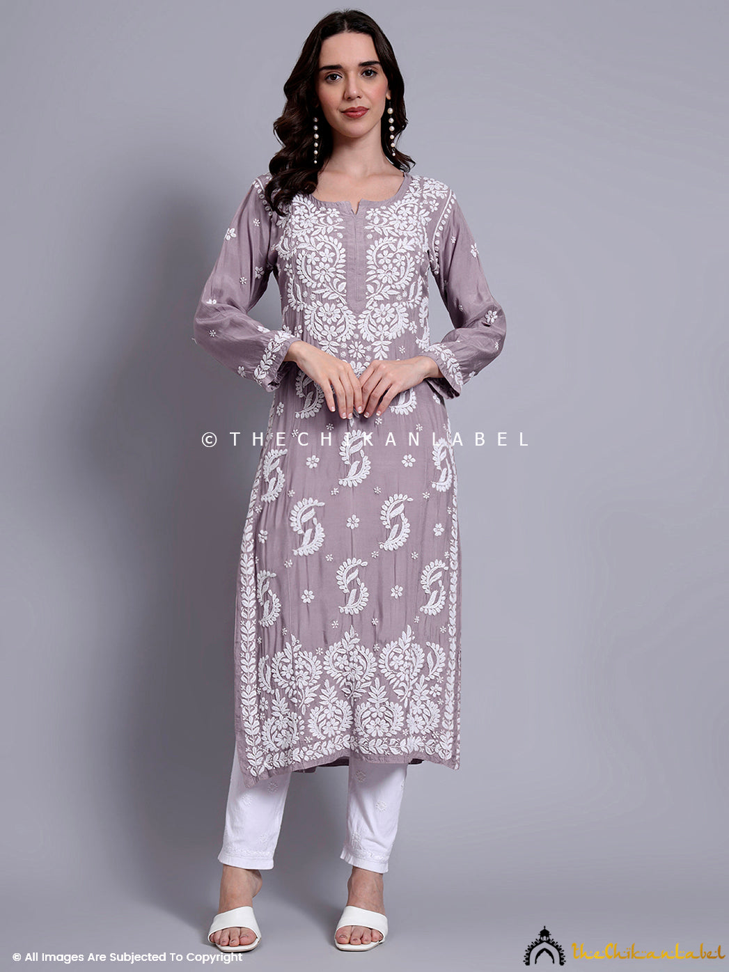Soft muslin kurti for women with front buttoned yoke and hand-embroidered chikankari patterns.

