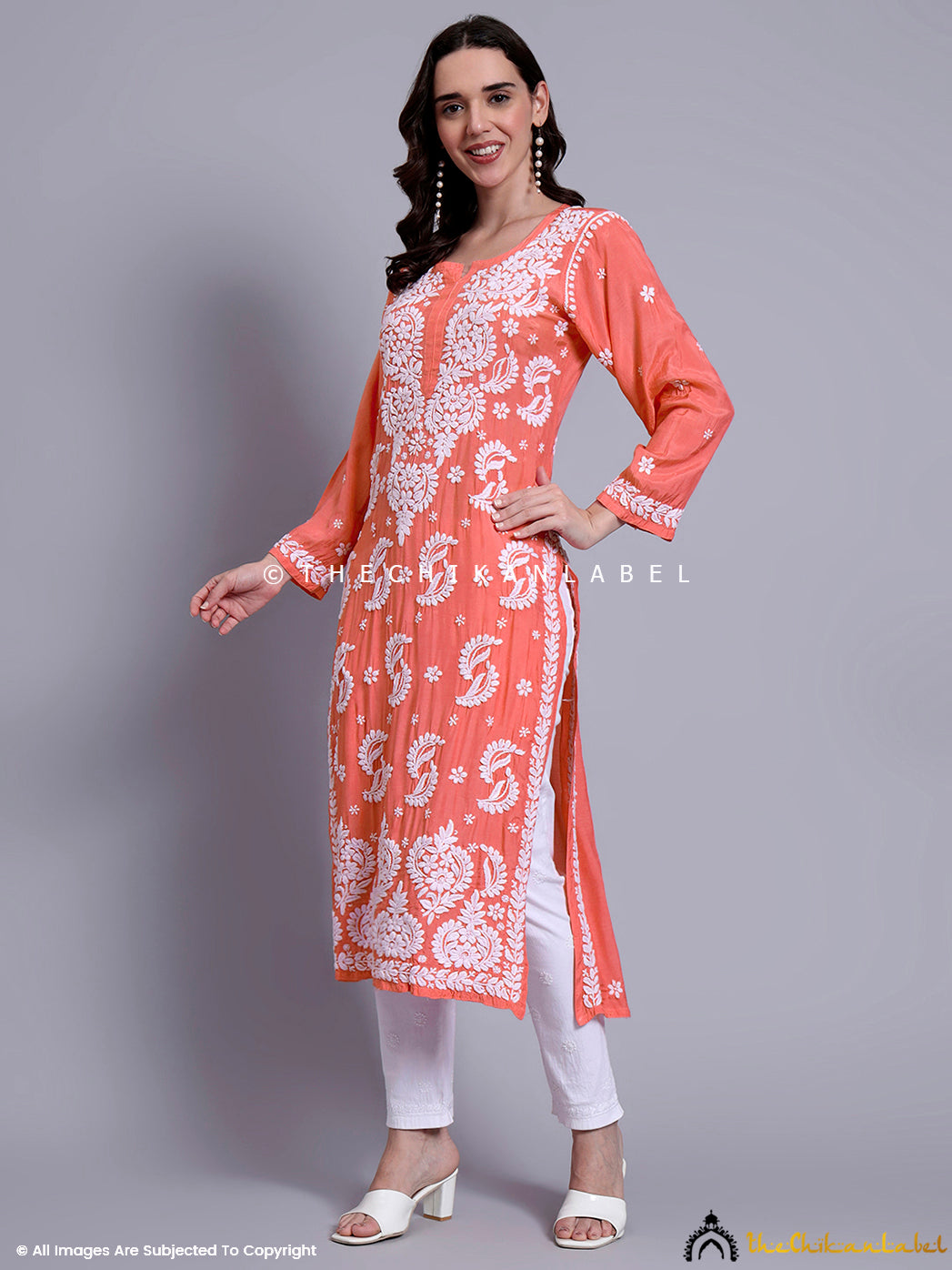 Casual yet elegant ethnic outfit featuring handcrafted muslin kurti with intricate thread motifs.

