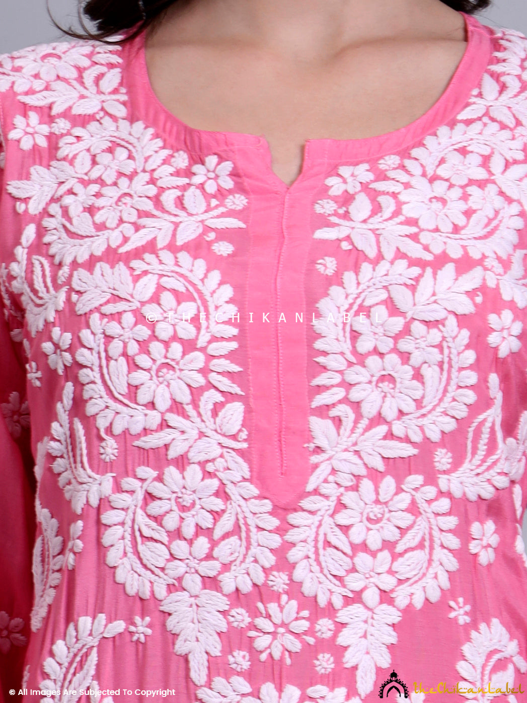 Full-length image of a chikankari kurti made from breathable muslin with intricate floral embroidery.

